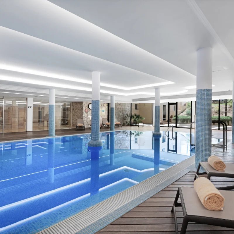 Heated indoor pool at CM Mallorca Palace spa in Sa Coma