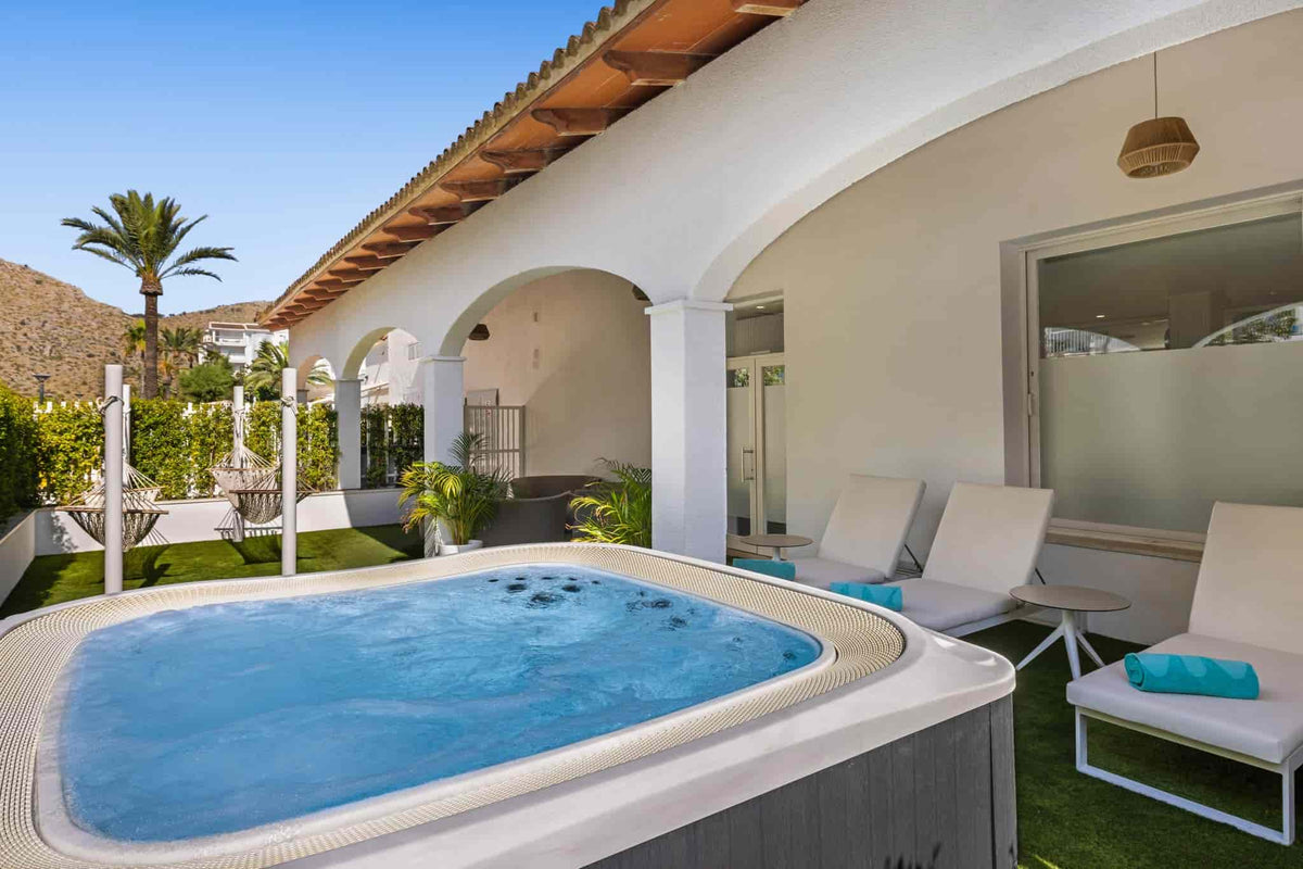 Unwind in the jacuzzi at Spa Viva Sunrise in Mallorca, offering a soothing hydrotherapy experience for ultimate relaxation.