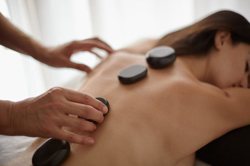 Therapeutic Hot Stone Massage: Deep Relaxation and Wellbeing at Mallorca Wellness - MallorcaWellness