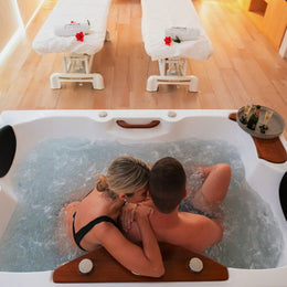 Couple relaxing in private jacuzzi at luxury spa hotel in Mallorca. Private jacuzzi and couples massage experience at 4-star hotel in Mallorca. Romantic spa day with private jacuzzi for two in Mallorca