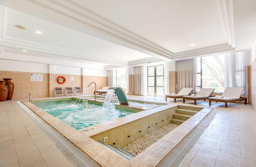 Enjoy the heated pool at Spa Viva Cala Mesquida Suites in Mallorca, designed for a tranquil and rejuvenating spa experience.